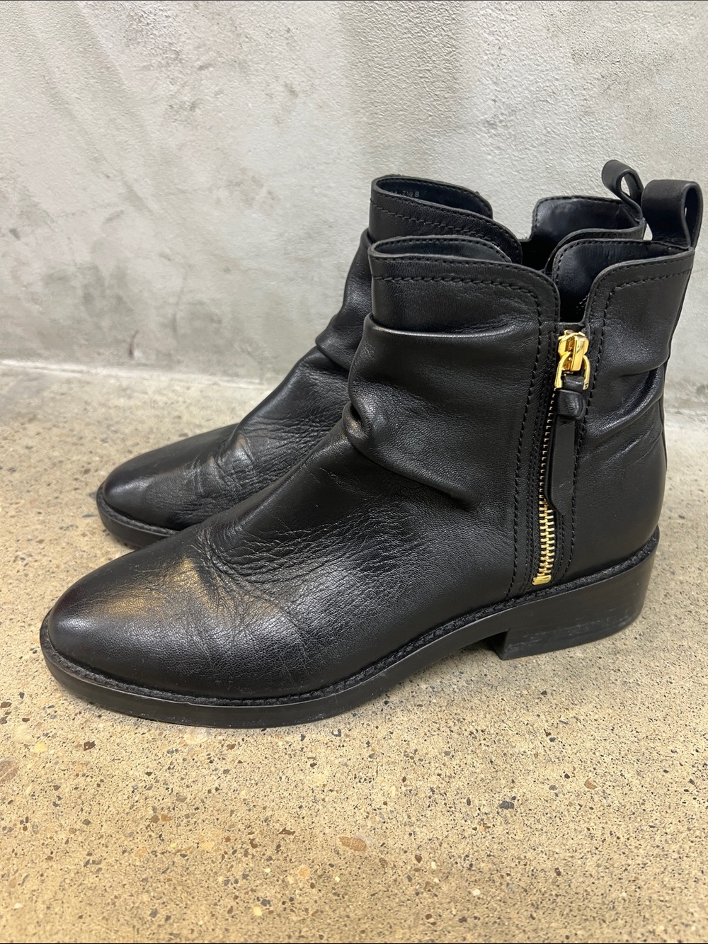 Cole Haan Black Leather Zip Ankle Booties with Gold Hardware